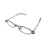 Armação de óculos feminina oval com detalhes metálicos e hastes finas, ideal para óculos de grau.